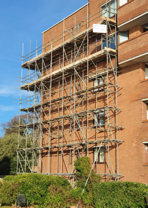 Tall multi-lift scaffold on a commercial building